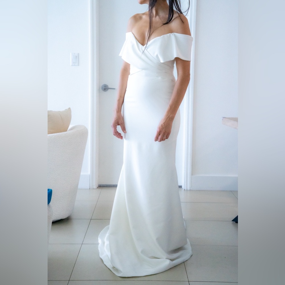Never worn wedding dress by Madeline